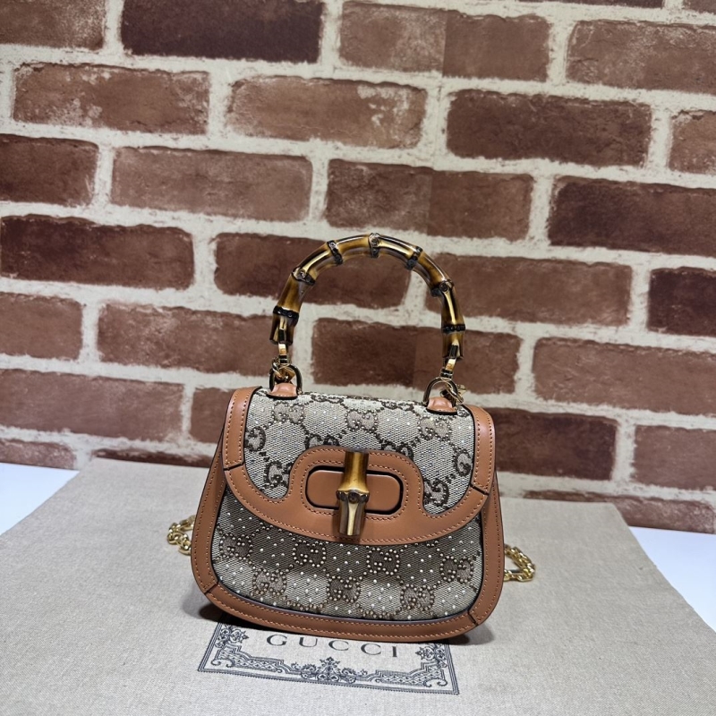 G*u*i top handle bags